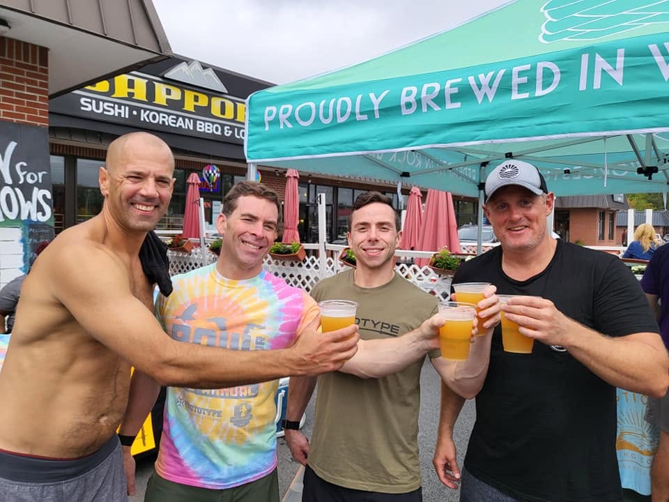 Mark, Brendan, Coach Jon, and Tim Furbush together after a Row for Westborough community event