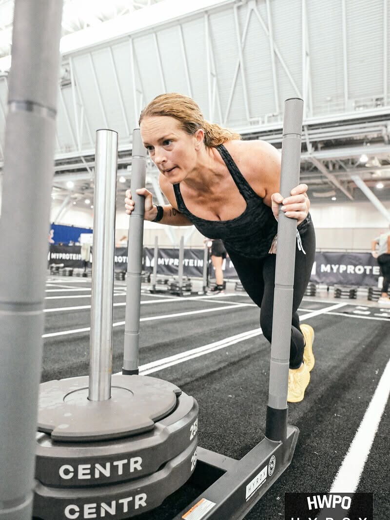 Natalie Beyranevand pushing the sled at HYROX Boston