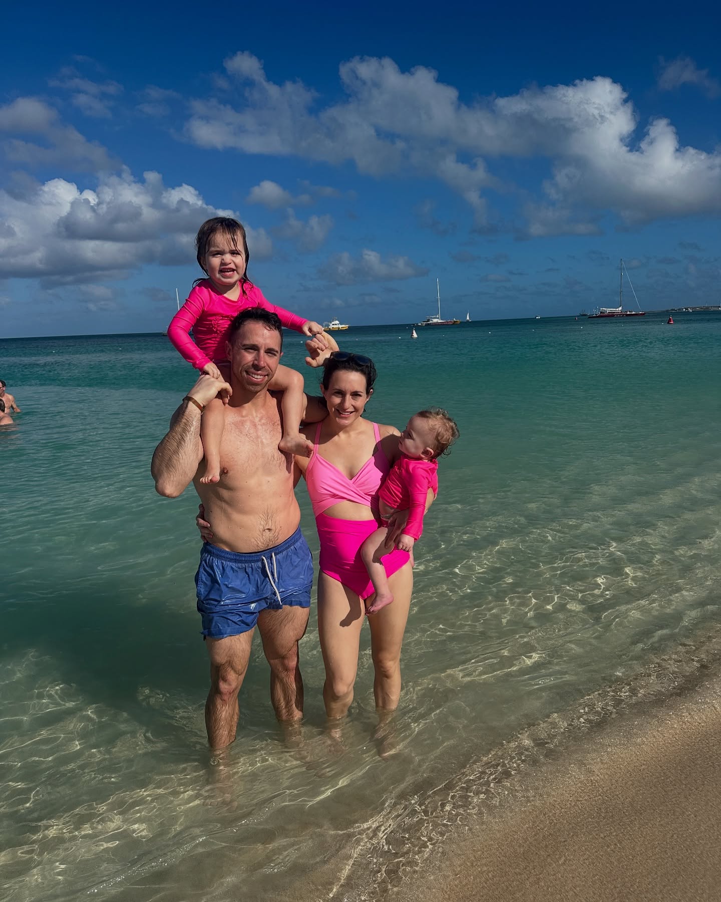 Erin, me, and our daughters on vacation in Aruba, 2025