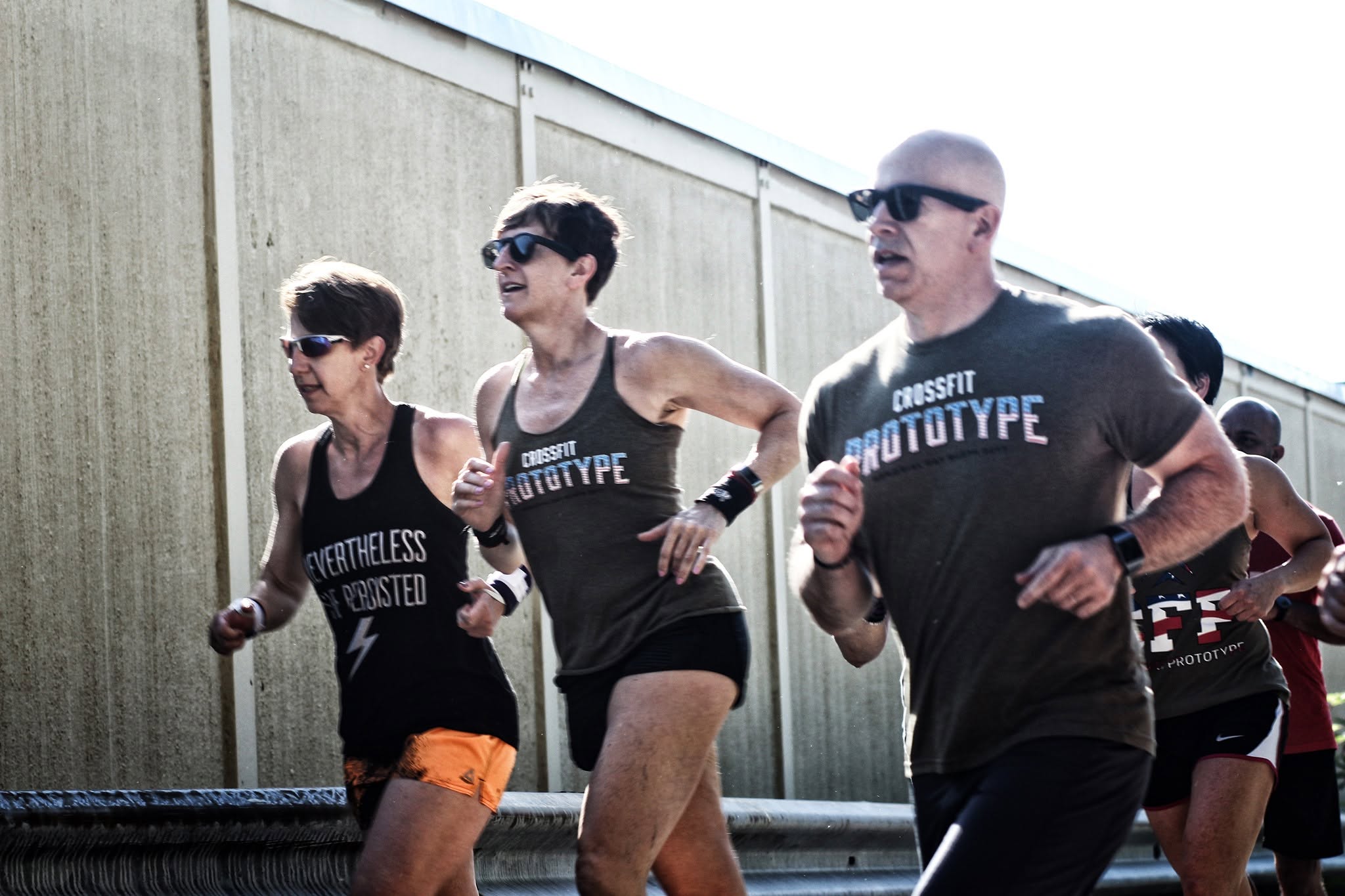 Liz, Peg and Todd Kinsman running Murph on Memorial Day at Prototype