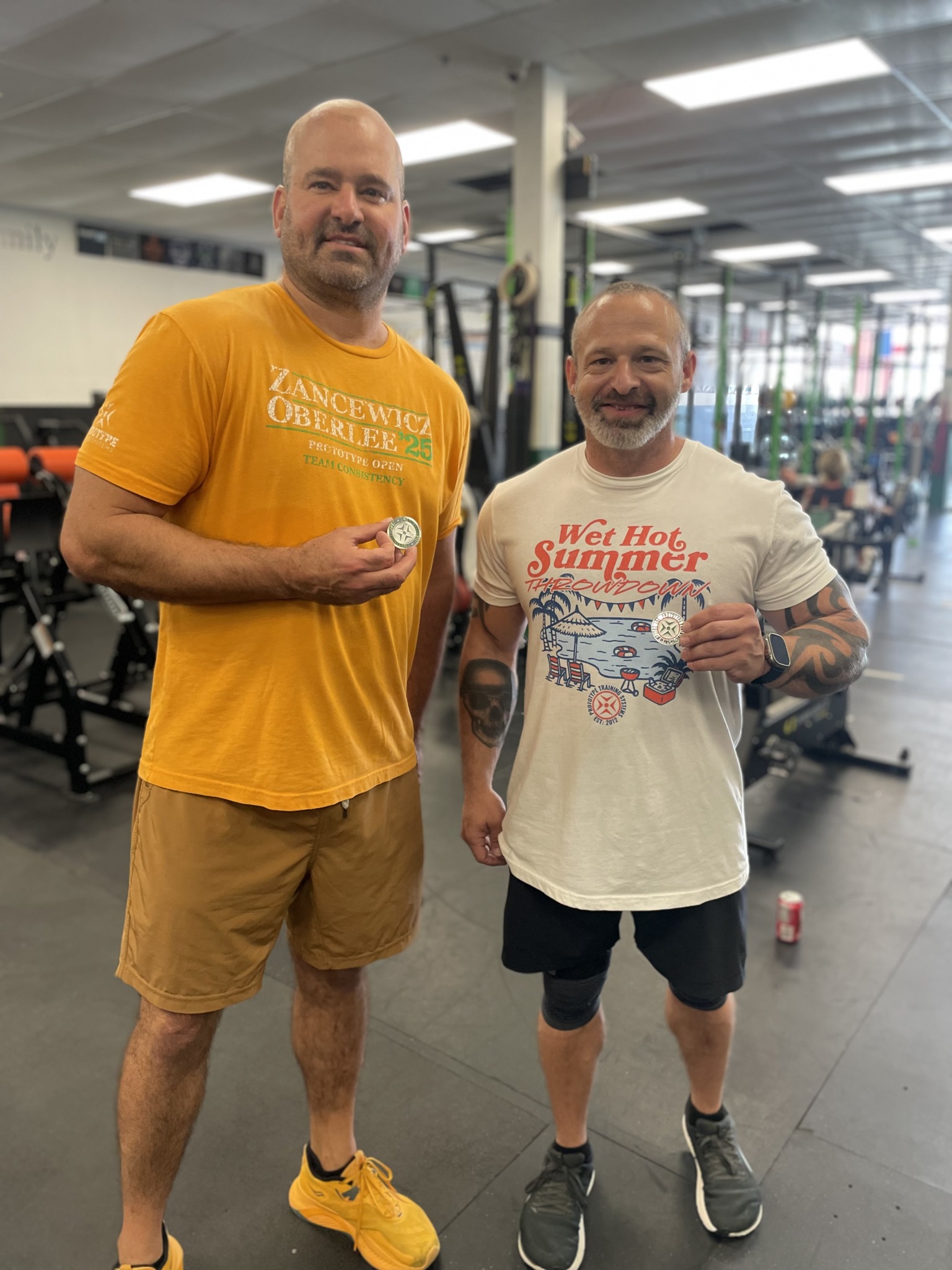 Tony Pittman with Damon earning a Prototype Challenge coin for completing the 30 Day Hard challenge