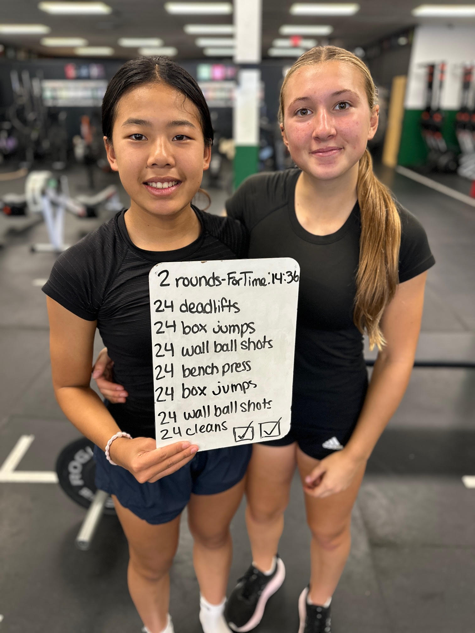Lainey and her teammate Ella after a 24 Heroes in 24 Hours workout at Prototype