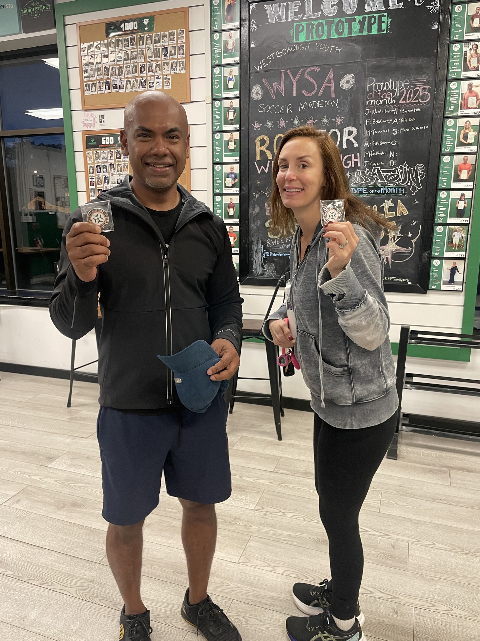 Jen receiving her 30 Day Hard Challenge coin