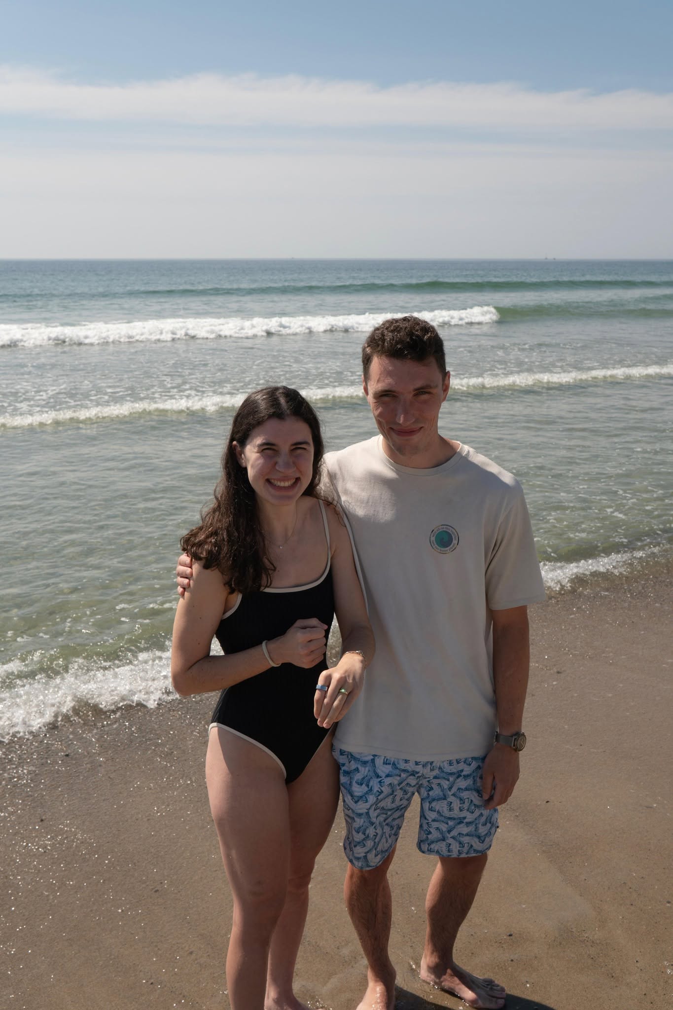 Devon LaMachia and Ed Matatall just after their engagement on a beach in Maine