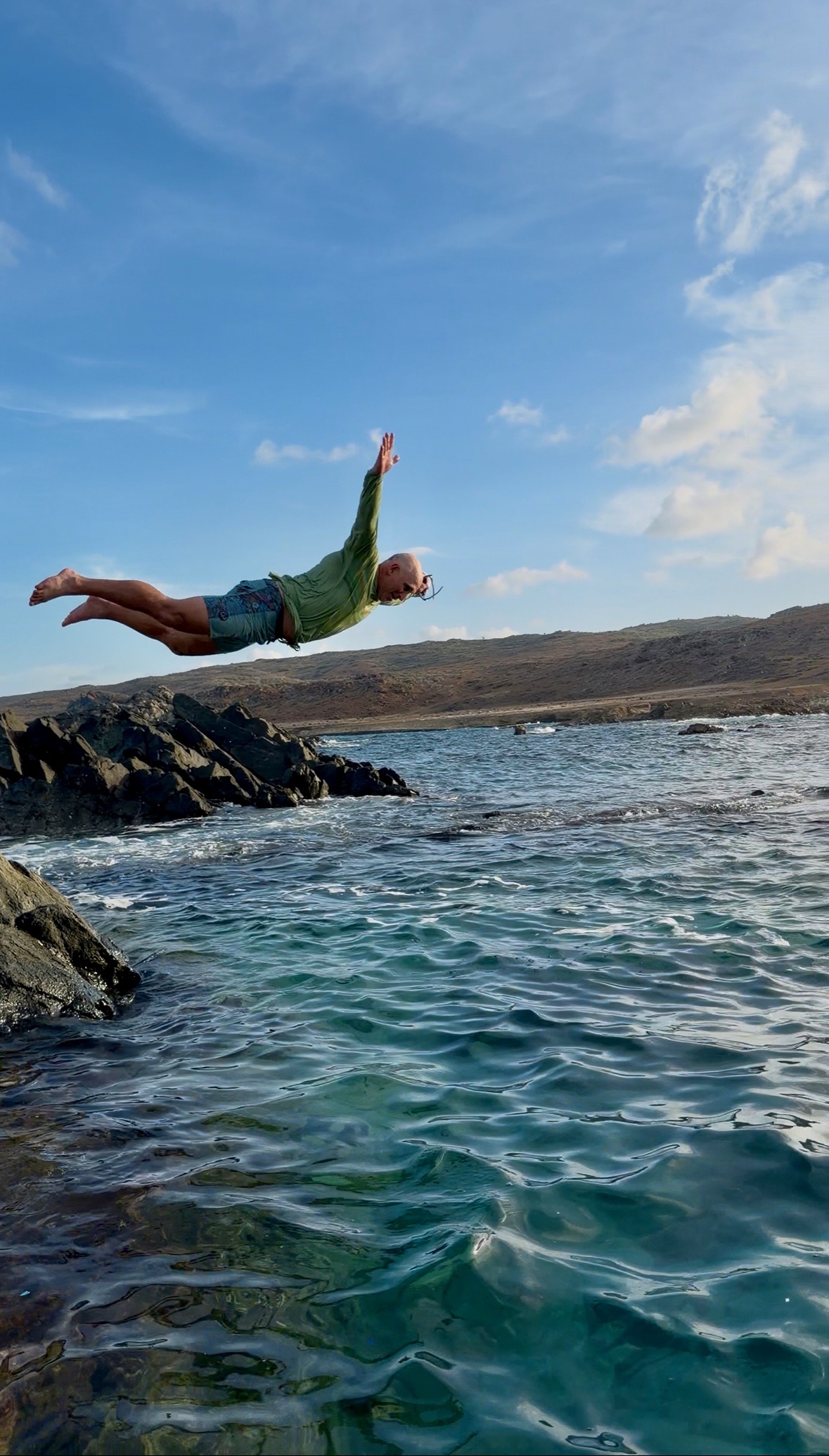 Mark Higgins diving into the water