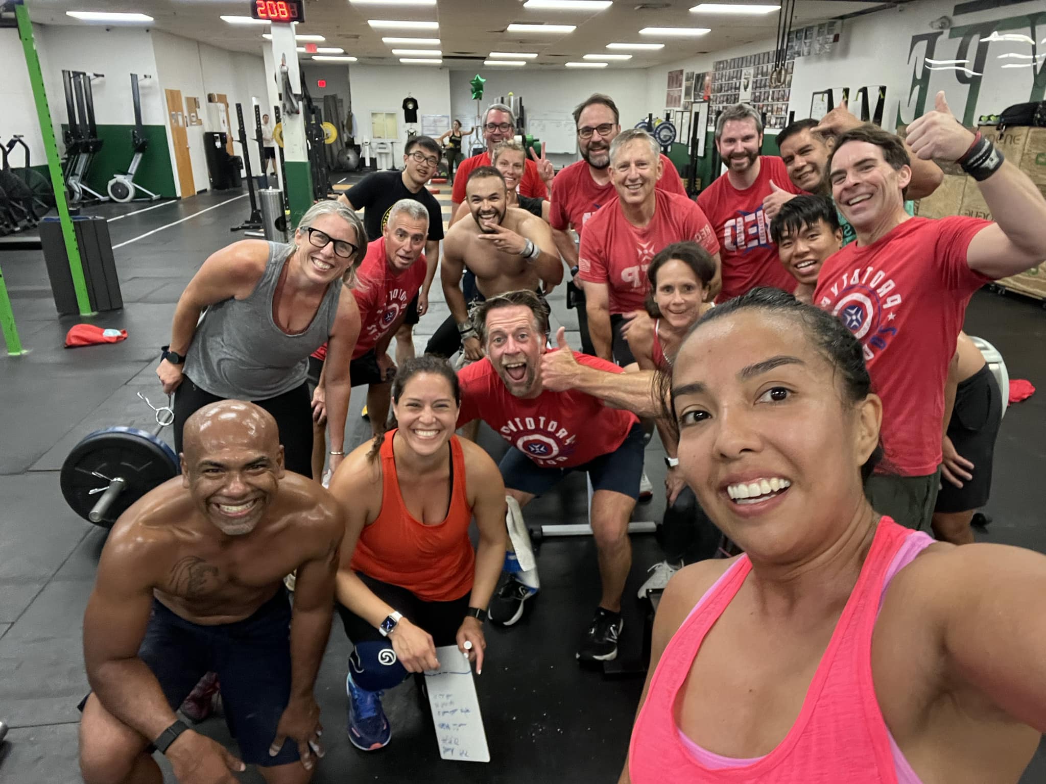 Melina with her 7am CrossFit class wearing R.E.D. (Remember Everyone Deployed) shirts on a Friday at Prototype Training Systems