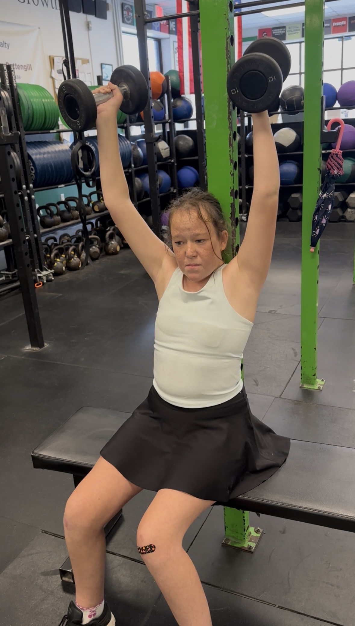 Molly Dulac lifting weights at Prototype