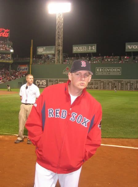 A younger Kyle Graham in a Red Sox uniform on the field at Fenway Park