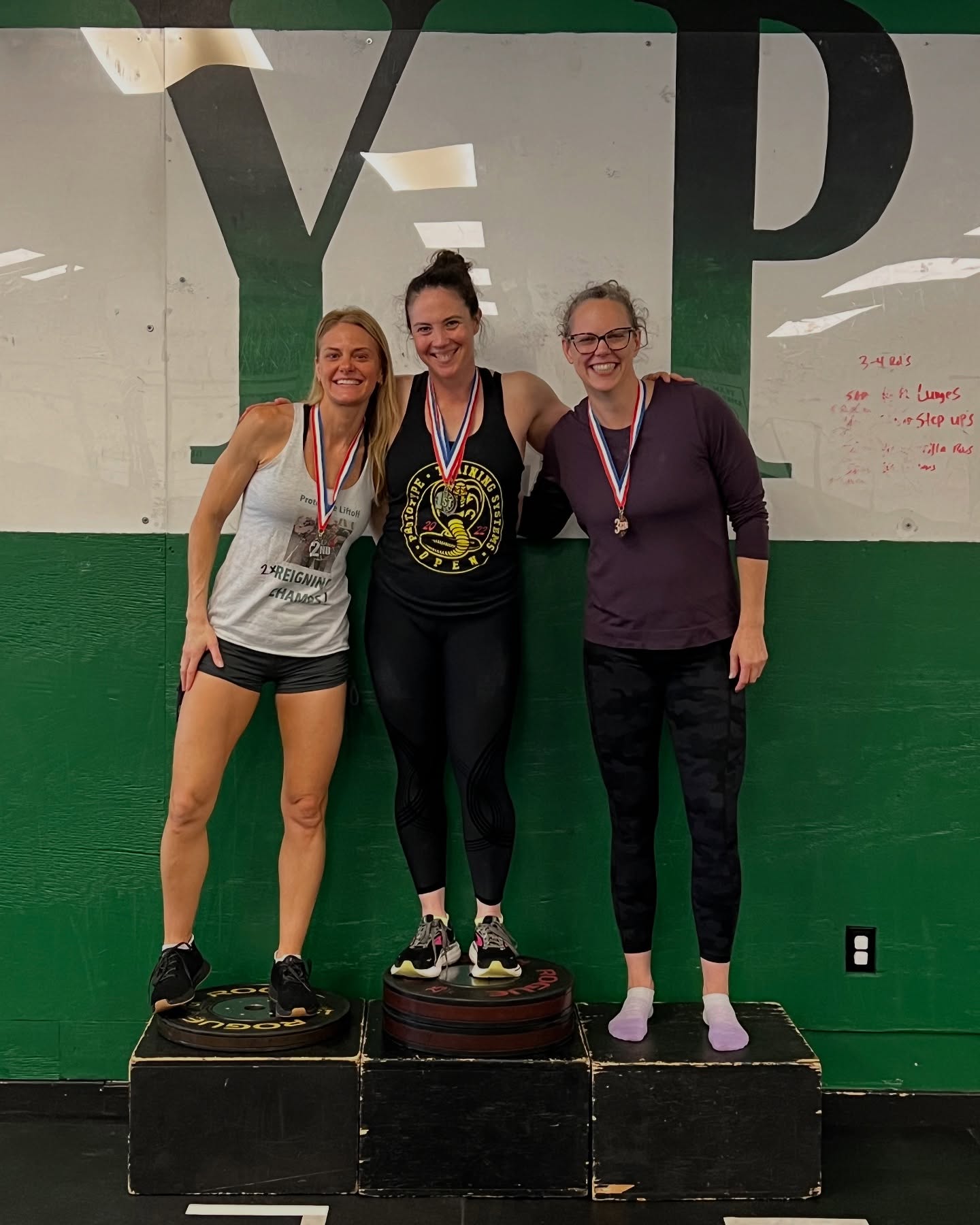 Liza Davis on the podium at the annual Lift Off competition at Prototype Training Systems
