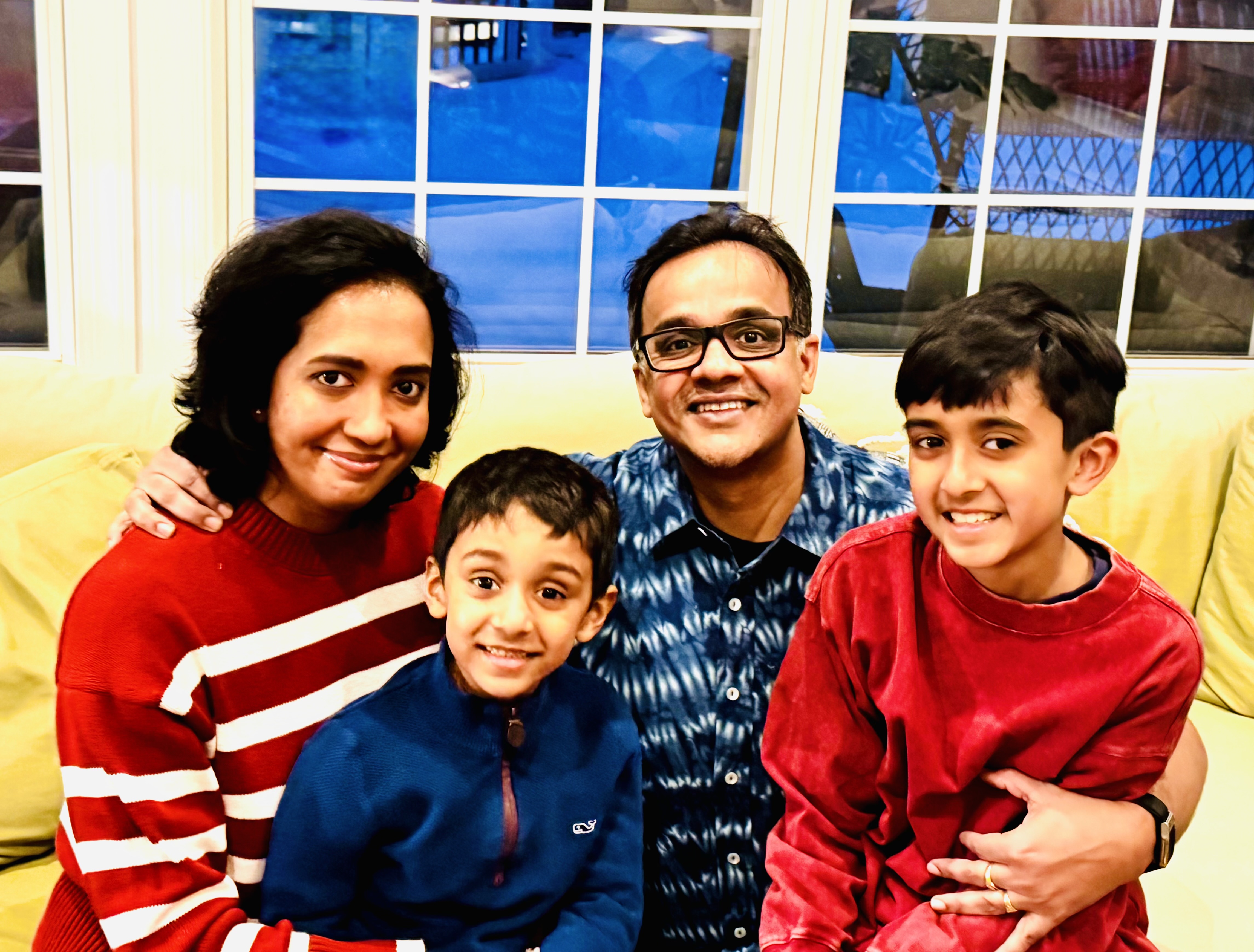 Deepak Mohan with his wife, two sons, and his mom
