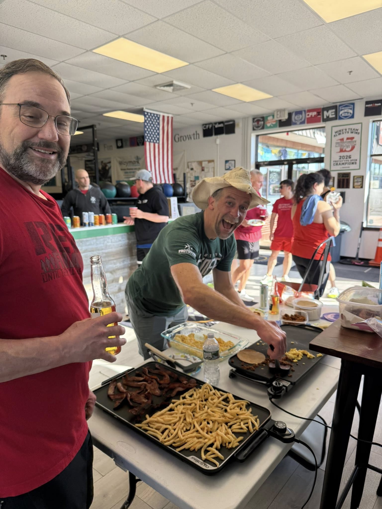 Mark Hardin cooking breakfast tacos for the 7:00 AM crew on Ocho de Mayo 2026 at Prototype Training Systems