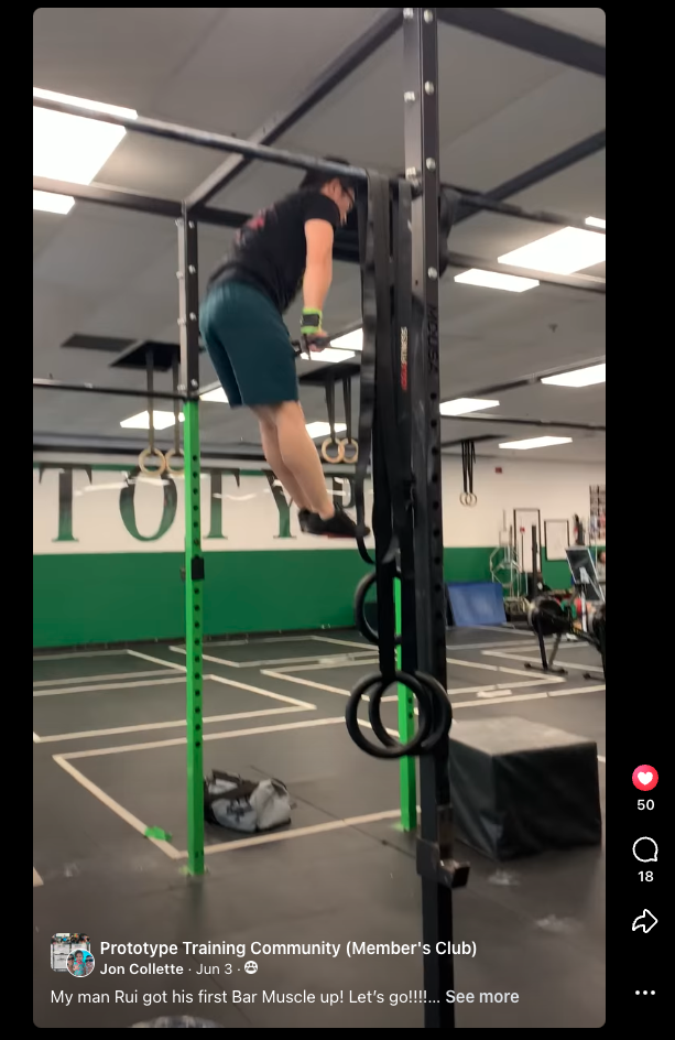 Rui Xu at the top of his first bar muscle-up at Prototype, June 2022