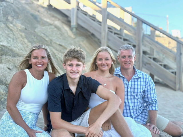 The Furbush family at the beach — Tim with his wife, his daughter, and his son