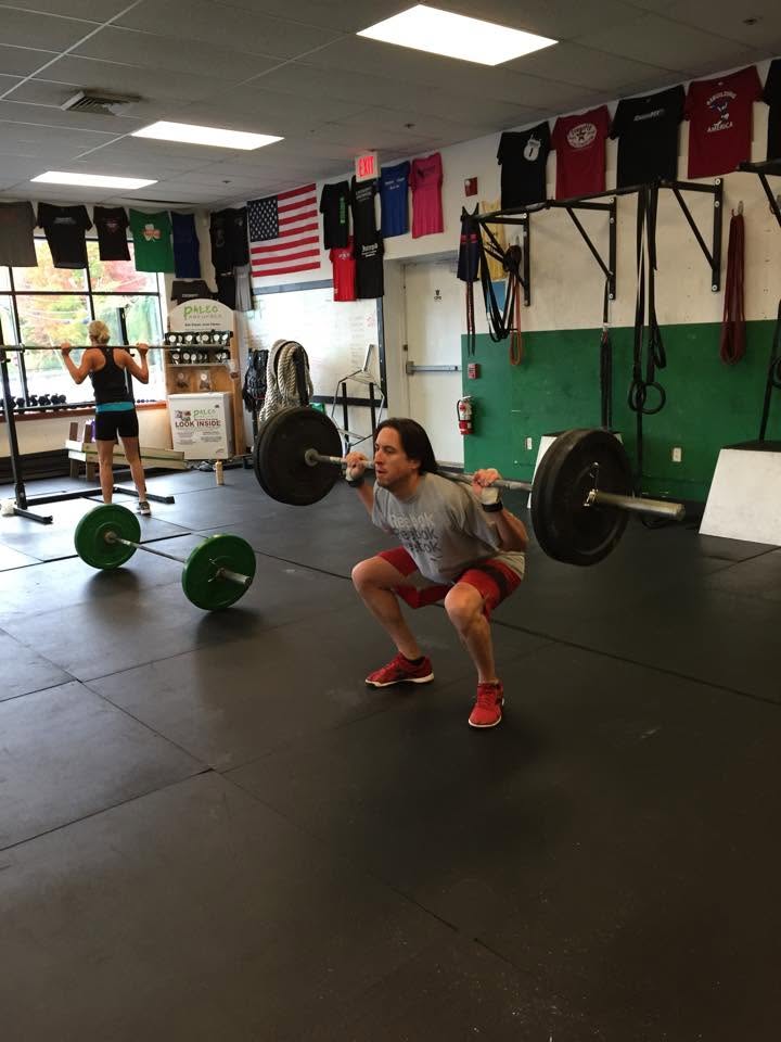 Jay Clancy squatting at Prototype in 2014