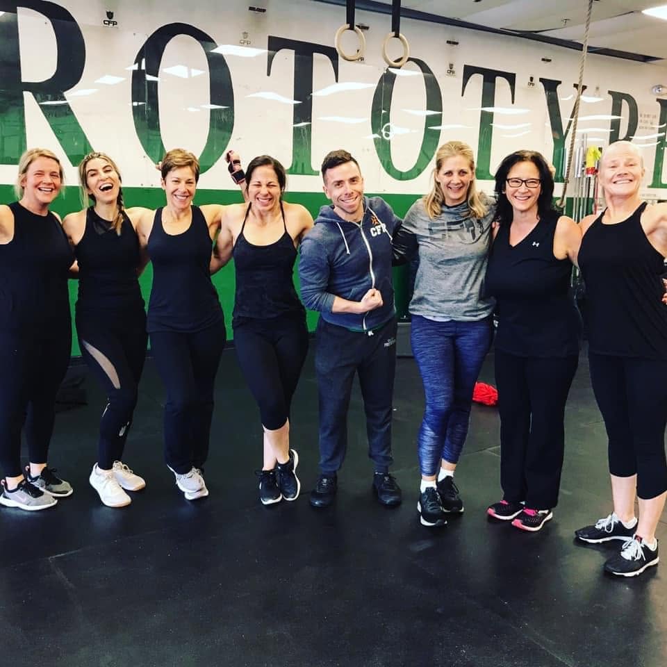 Kathy Bridge with the 8am class group and Coach Jon