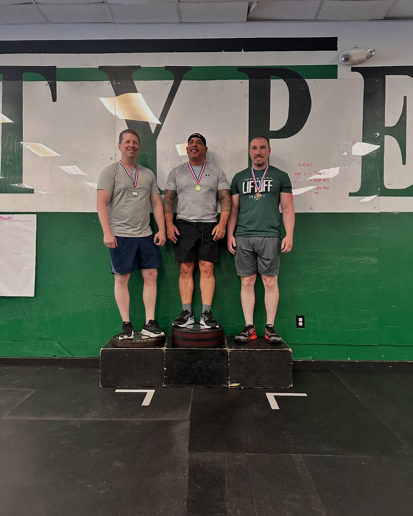 Jon Davis on the podium at the annual Lift Off competition at Prototype Training Systems