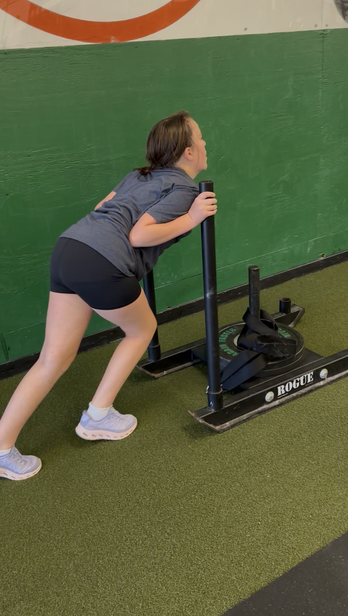 Molly Dulac pushing a sled at Prototype
